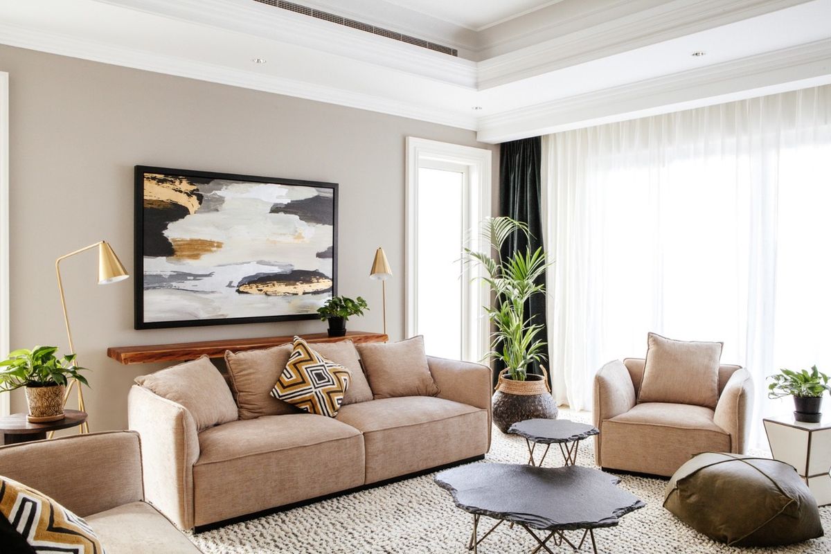 Living room in Dubai with floor-to-ceiling sheer and lined curtains made by Home Specialists