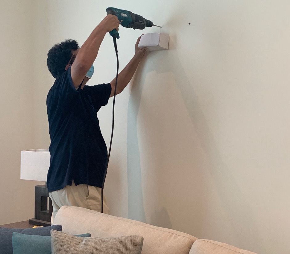 Home Specialists fitter installing a curtain track