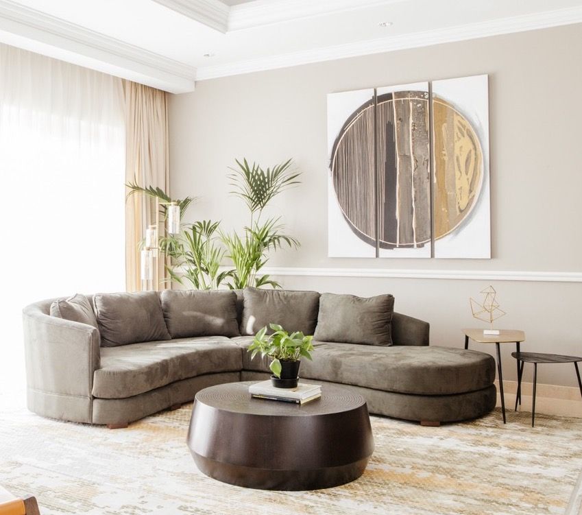 Curved custom sofa in taupe fabric made in the Home Specialists workshop