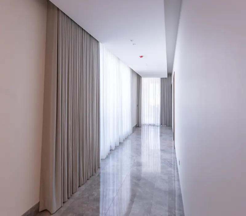 Wave-fold curtains in a corridor